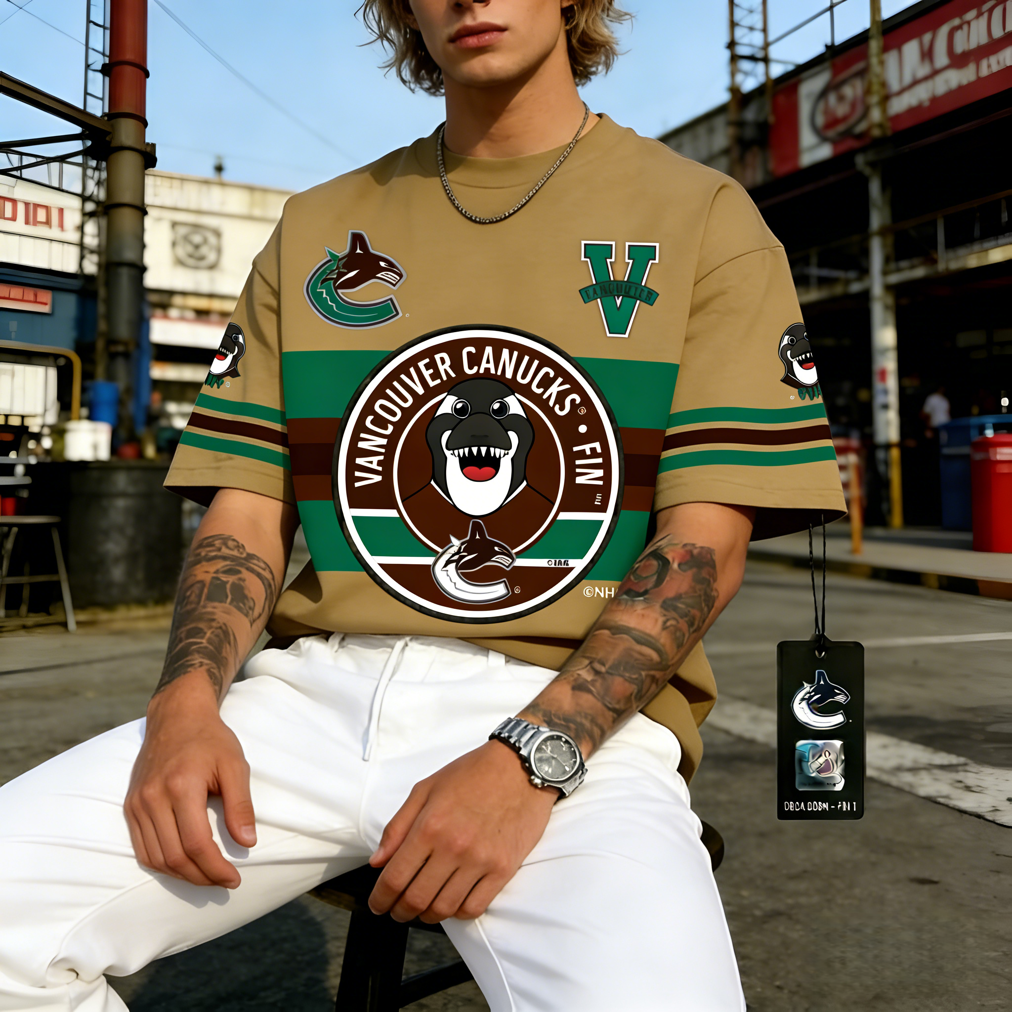 T-shirts featuring the NHL team "Vancouver Canucks" and their mascot "Fin the Whale"