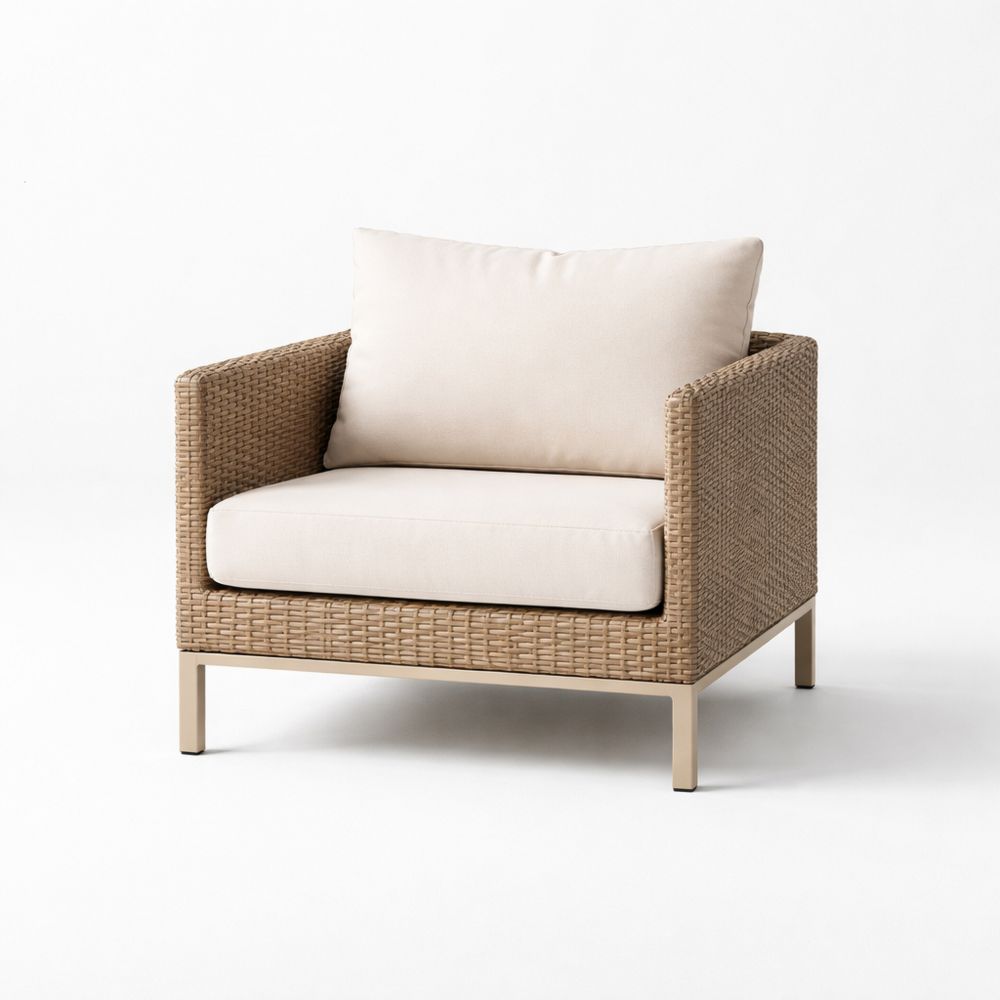 Rattan outdoor armchair with aluminum legs and beige cushions