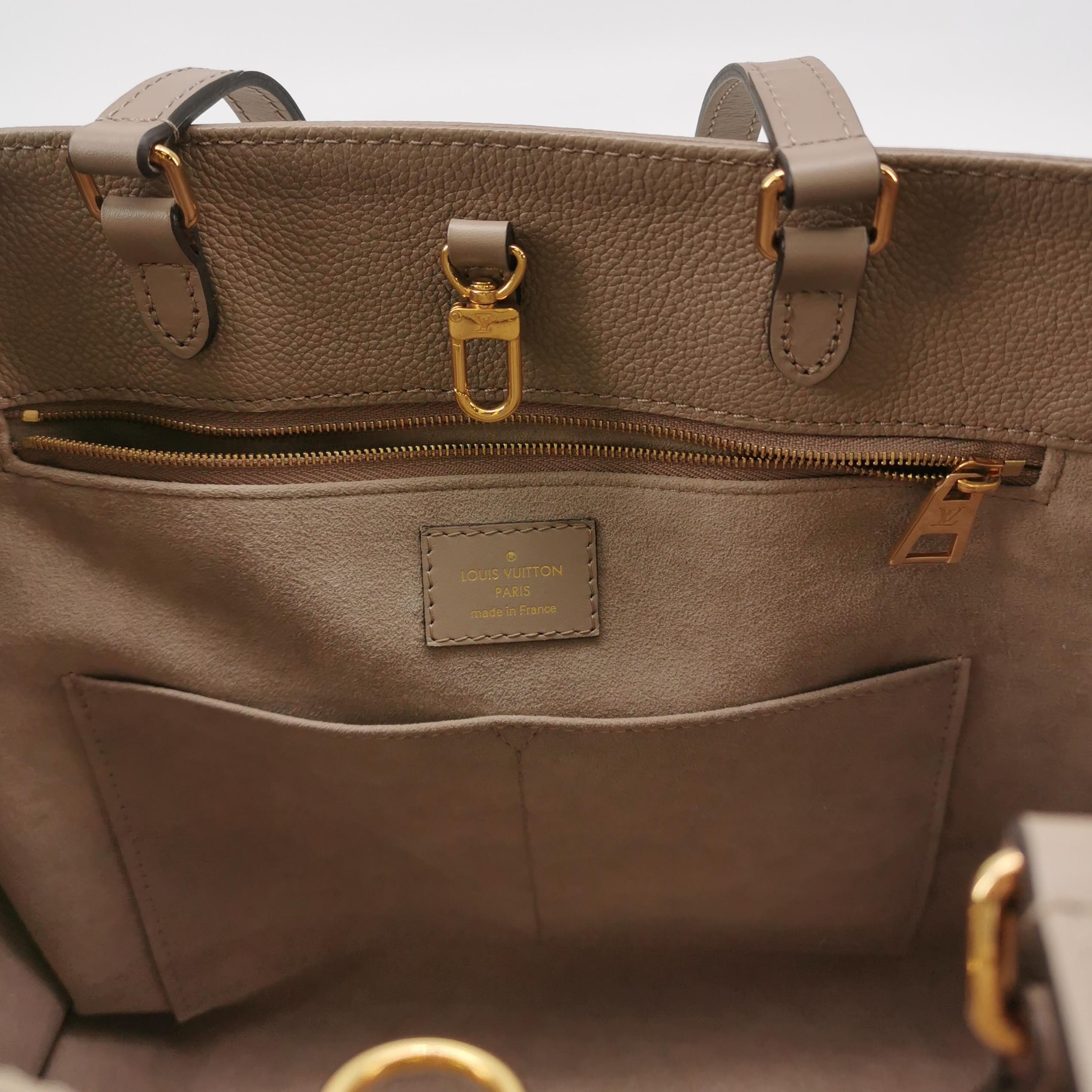 Louis Vuitton(LV) OnTheGo Tote Monogram Empreinte Giant MM — photo 8 of 15