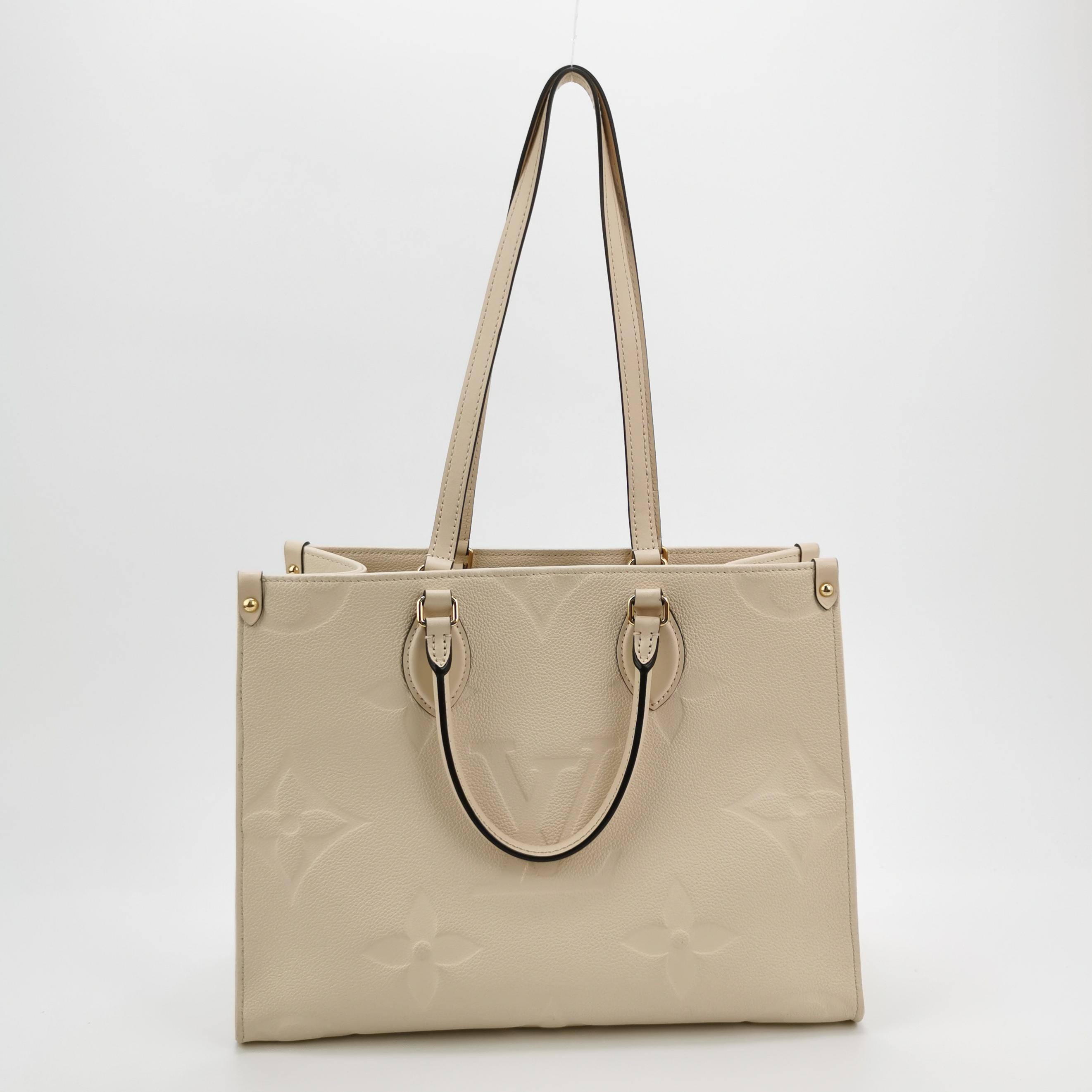 Louis Vuitton(LV) OnTheGo Tote Monogram Empreinte Giant MM — photo 3 of 15
