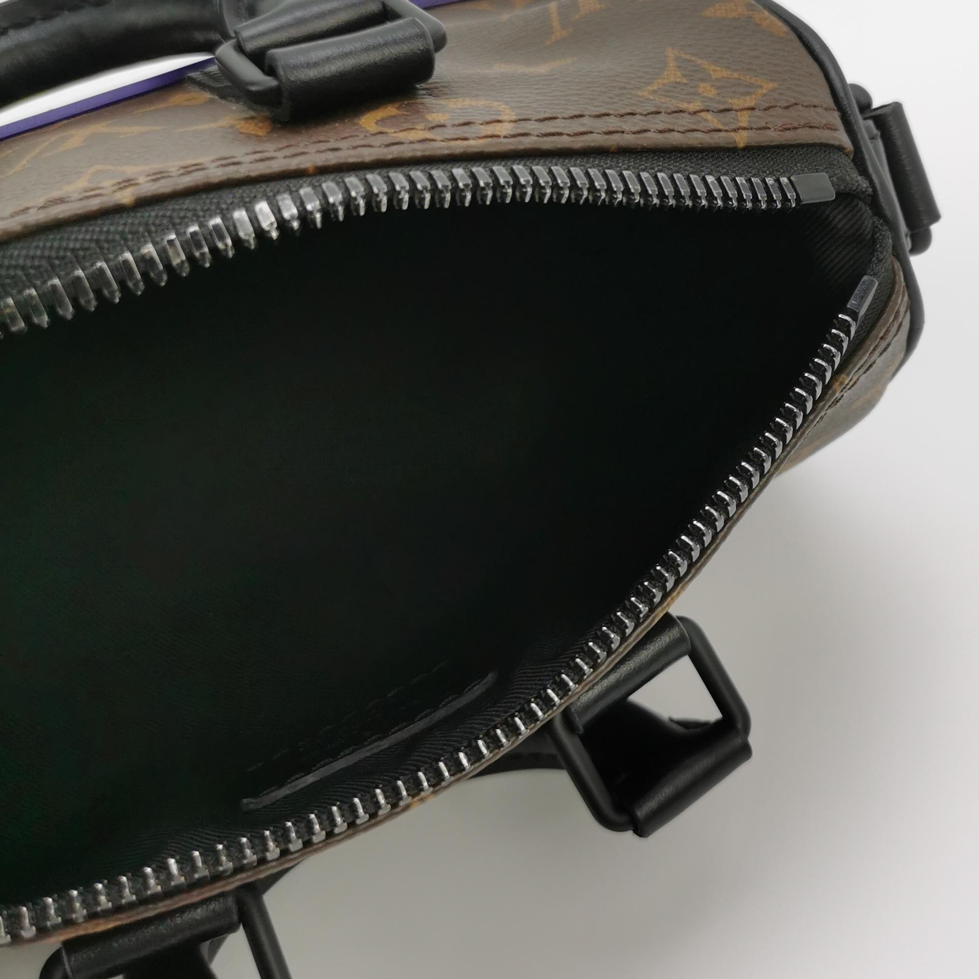 Louis Vuitton(LV) Monogram rubber Keepall XS — photo 10 of 13