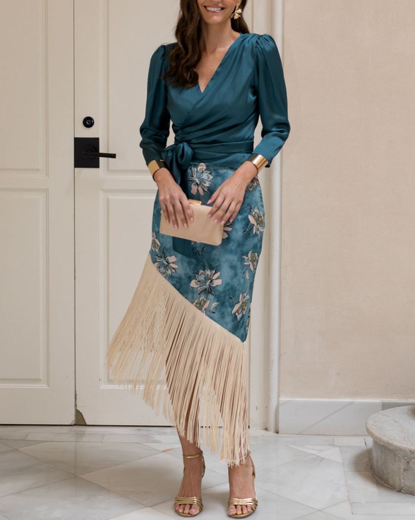 Blouse and fringed skirt set in petrol blue.
