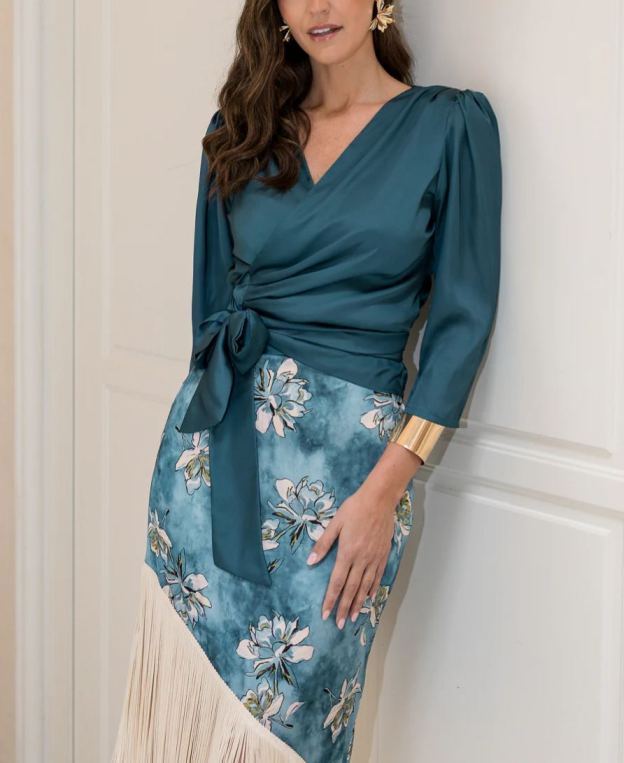 Blouse and fringed skirt set in petrol blue.