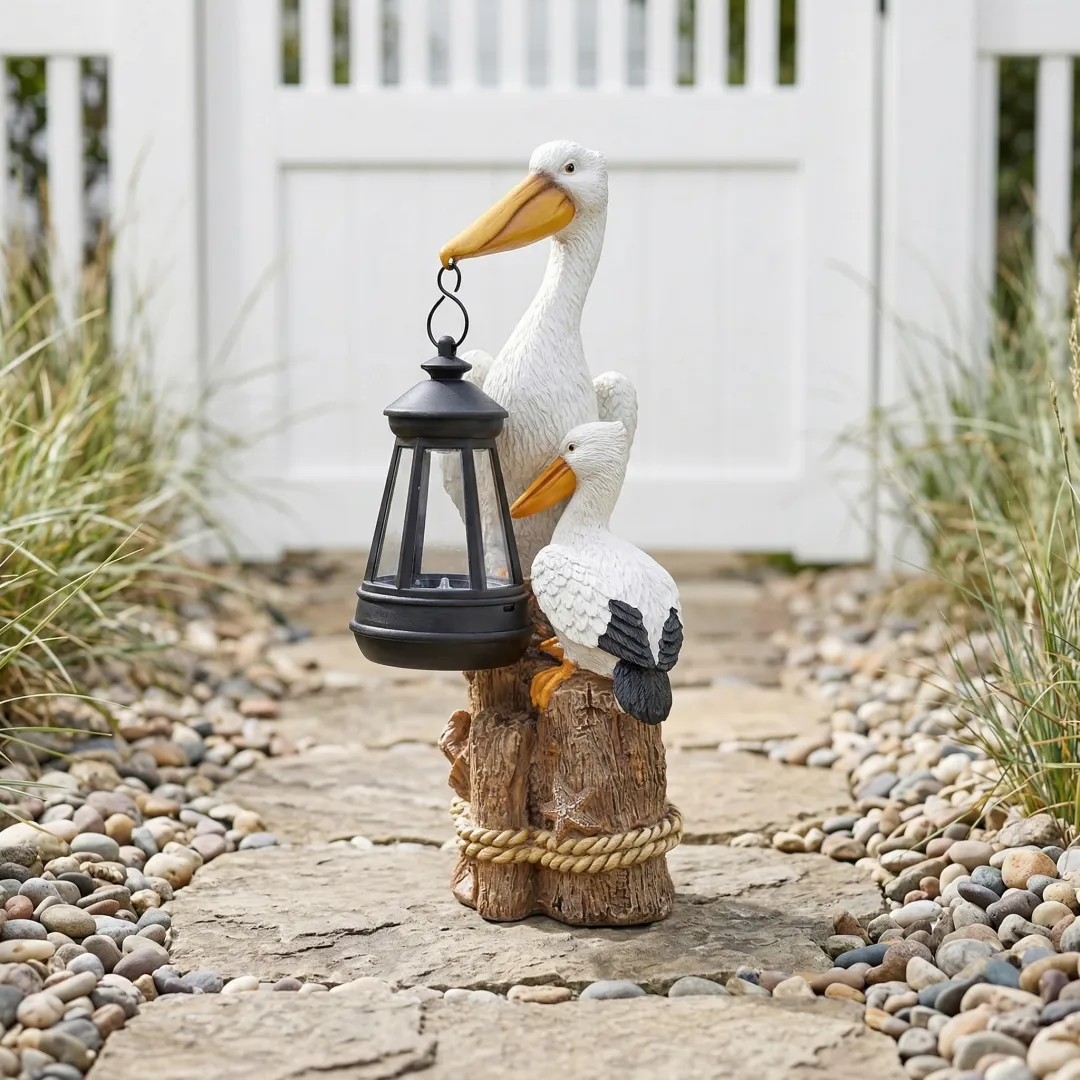 Whimsical Solar Pelican Mother & Baby Garden Lantern StatueThe sweet detail of the baby pelican leaning closely against the larger pelican gives this piece an especially warm, loving feel. From the textured feather detailing to the hanging lantern, wood-l