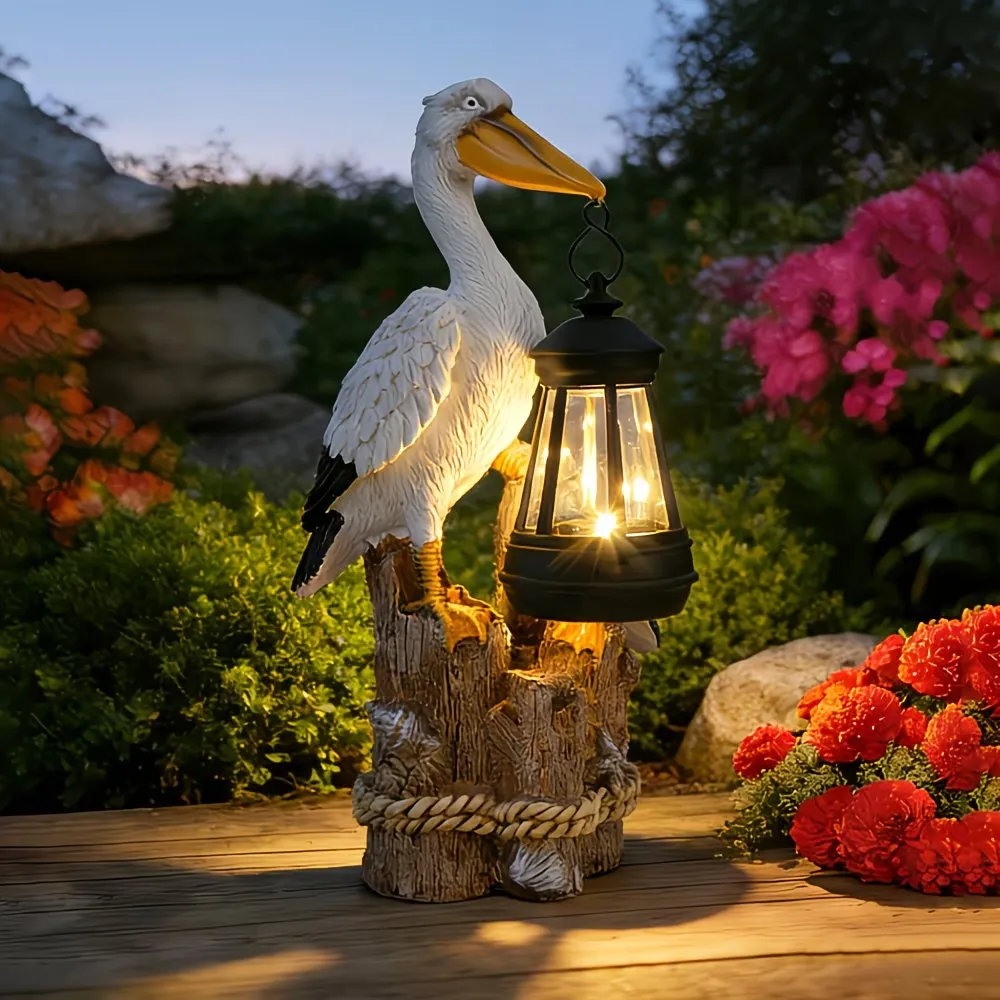 Whimsical Solar Pelican Mother & Baby Garden Lantern StatueThe sweet detail of the baby pelican leaning closely against the larger pelican gives this piece an especially warm, loving feel. From the textured feather detailing to the hanging lantern, wood-l