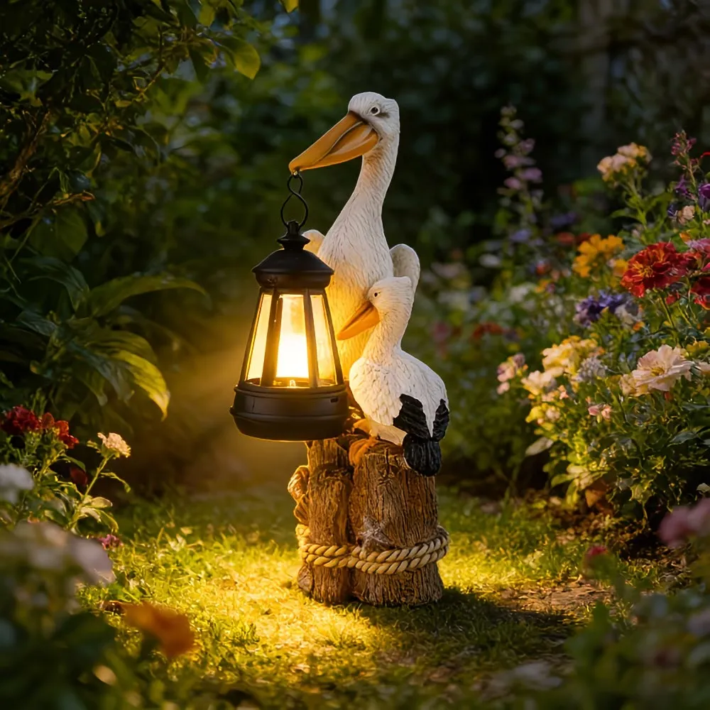 Whimsical Solar Pelican Mother & Baby Garden Lantern StatueThe sweet detail of the baby pelican leaning closely against the larger pelican gives this piece an especially warm, loving feel. From the textured feather detailing to the hanging lantern, wood-l