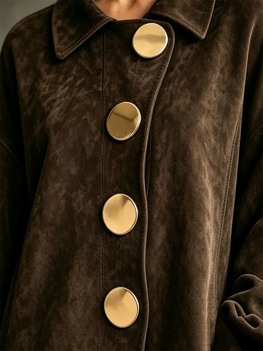 Oversized brass-tone button detail