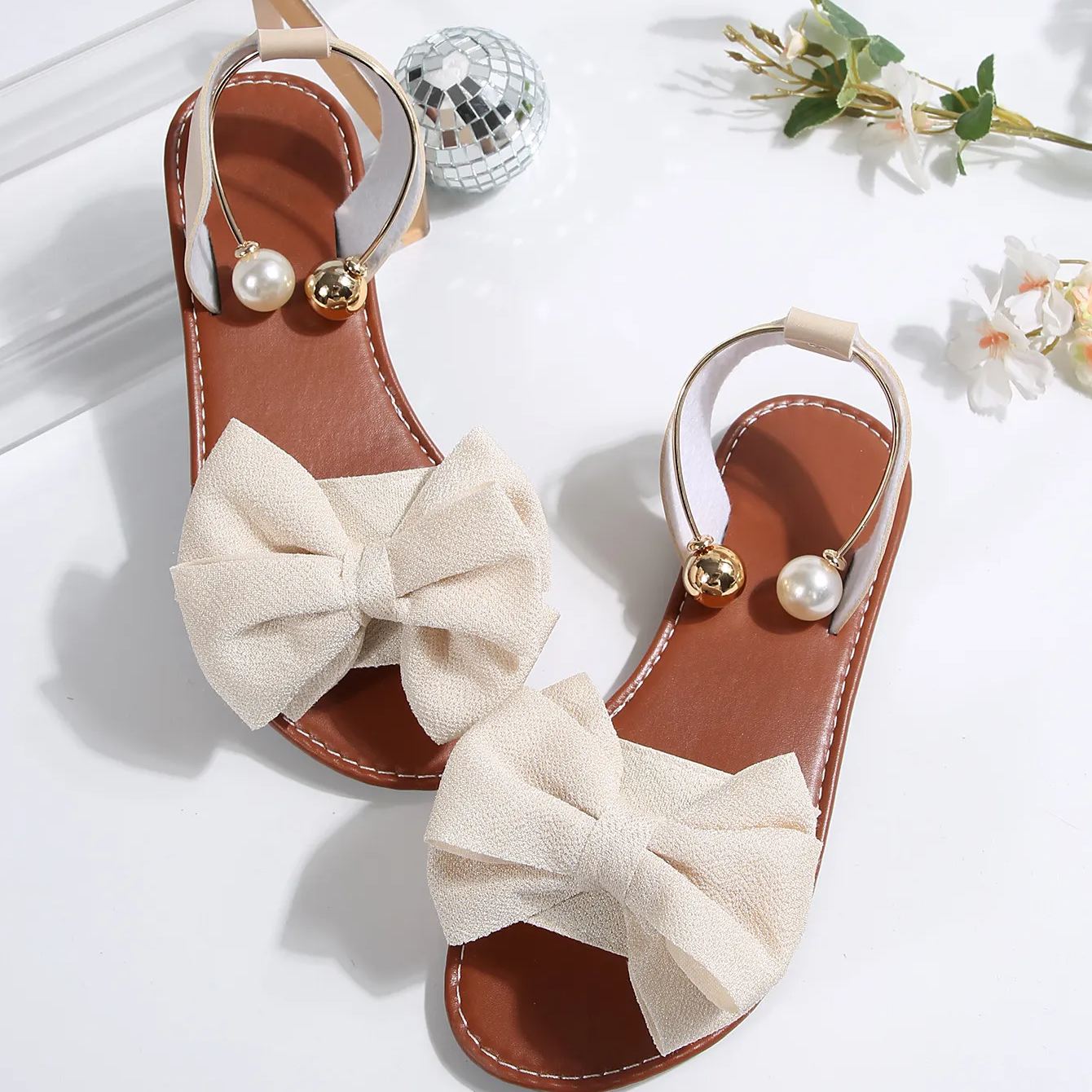 🔥LAST DAY 60% OFF🔥Women's Summer New Style Metal Buckle Single-Strap Flat Sandals with Bowknot and Pearl Versatile Casual Beach Sandals
