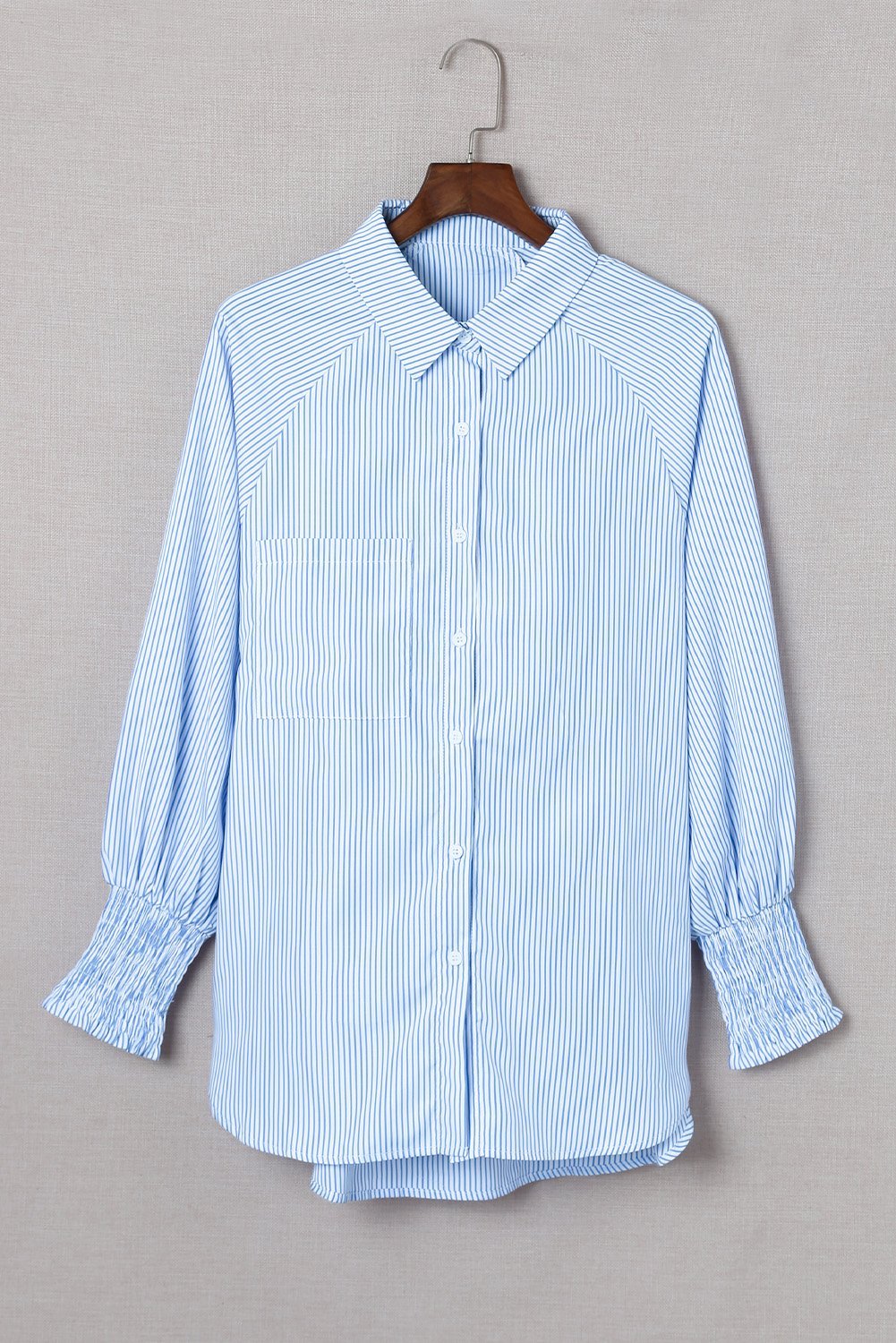 Mid-length smocked shirt with striped lapel and oversized drawdown sleeves