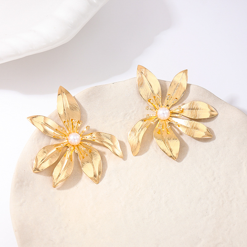 Women's Earrings Featuring A Striking Metallic Floral Design and Turquoise Accents