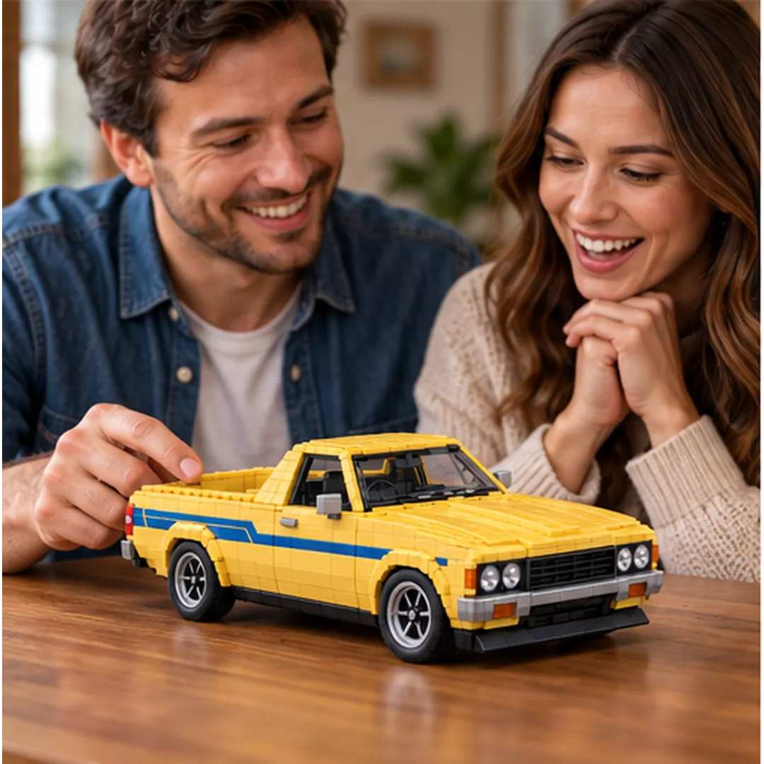 Two adults enjoying the completed yellow COASTLINE ’78 brick-built ute together at a wooden table