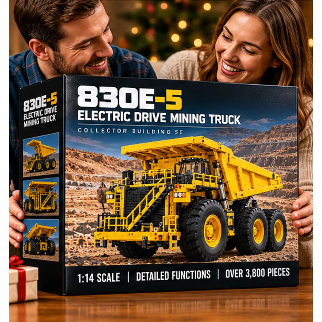 Adult hobbyist working on the yellow mining haul truck brick-built model at a table