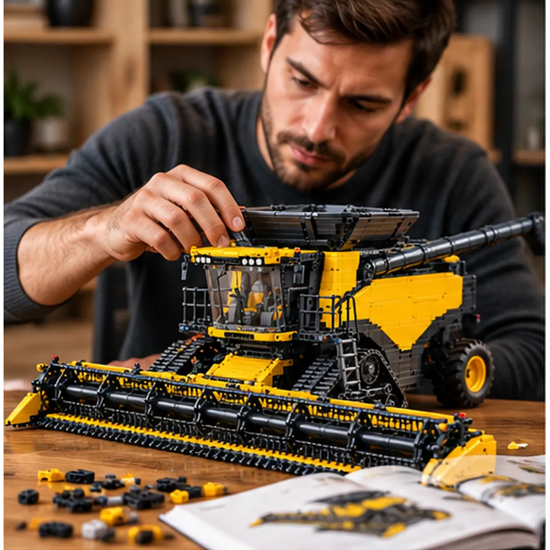 Adult hobbyist carefully assembling the yellow and black tracked grain combine model at a table with building pieces and instruction booklet