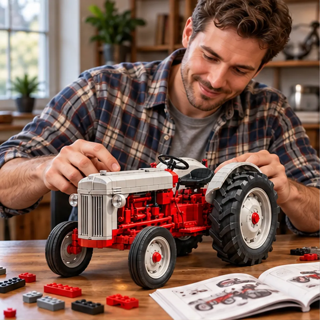 Adult builder assembling vintage 8N style farm tractor model