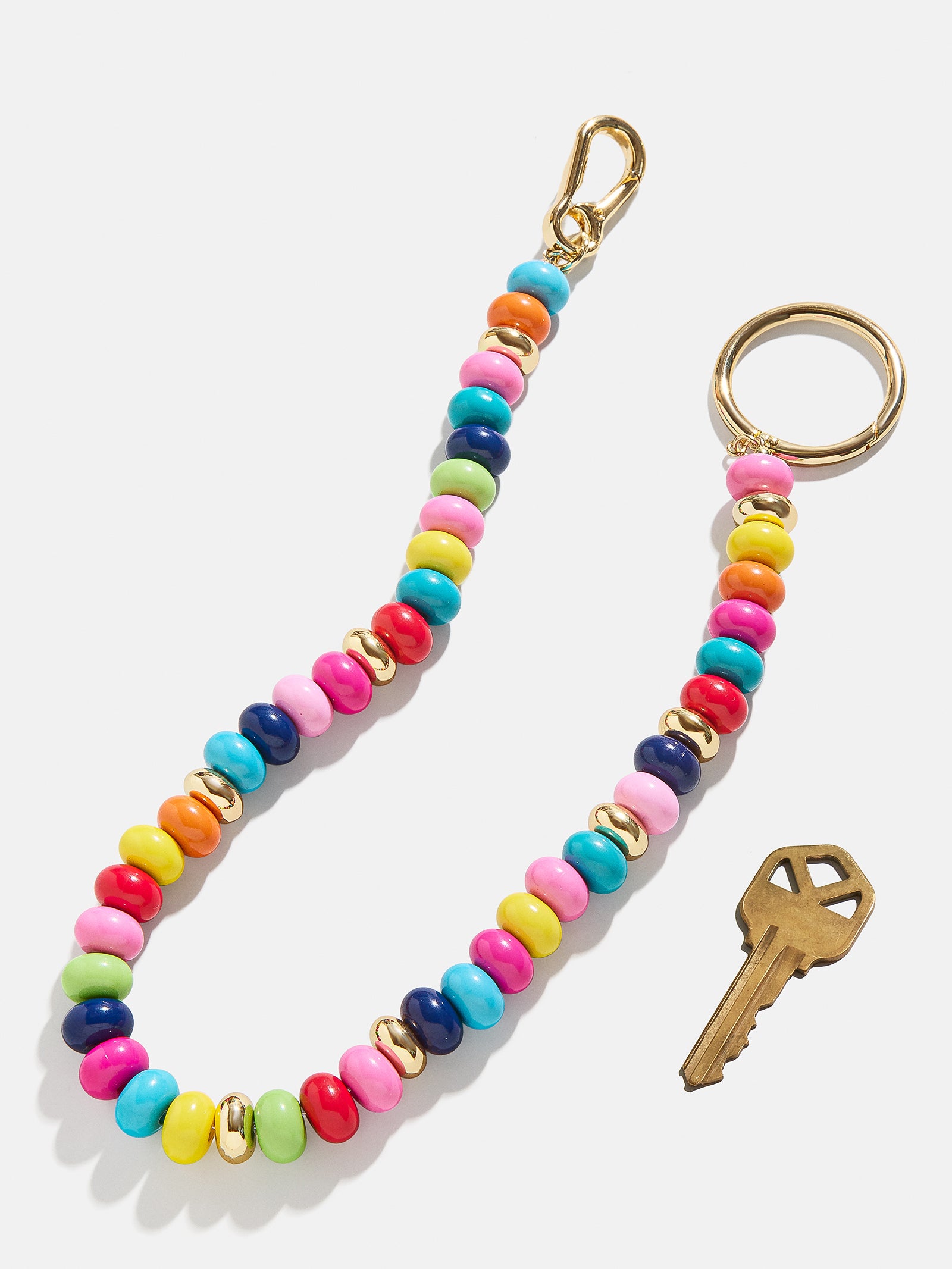 Flying Colors Bag Charm - Gold/Multi-Blues Comming