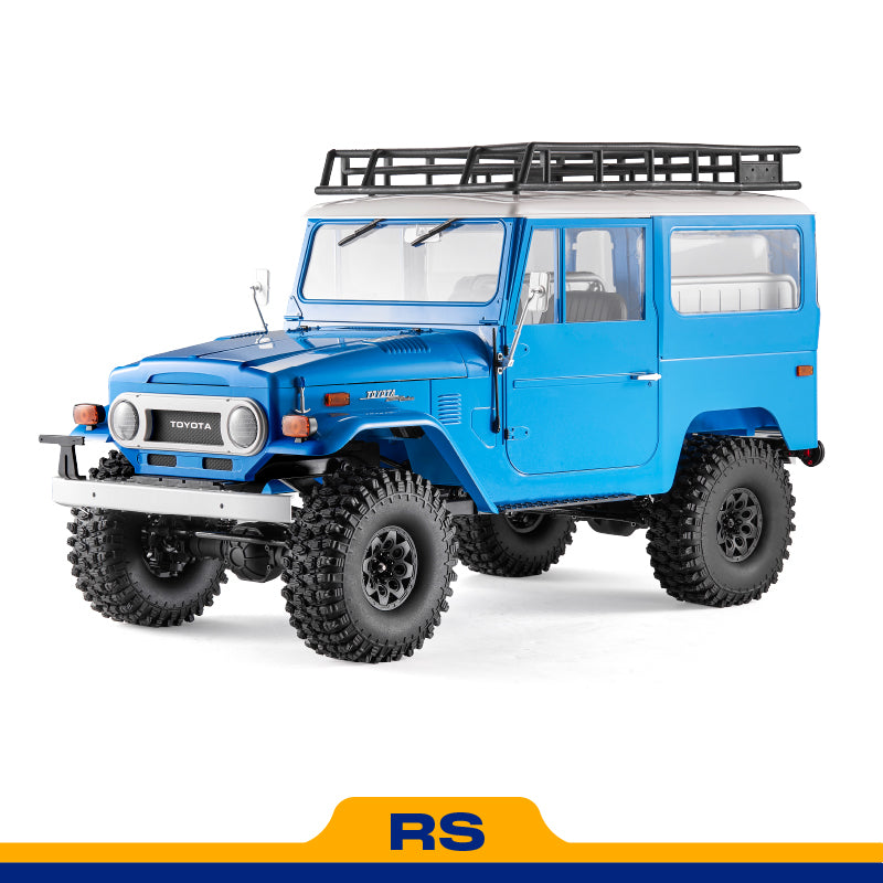 Blue FMS 1:10 Toyota Land Cruiser FJ40 RS RC rock crawler with roof rack and aggressive off-road tires.
