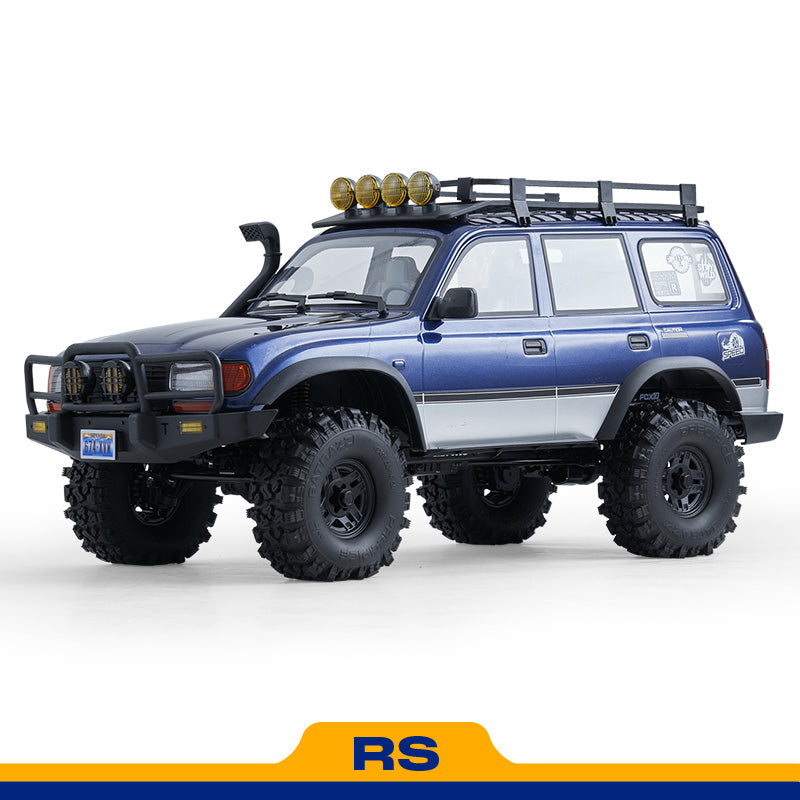 FMS 1:10 FCX10 PRO Brushless Toyota Land Cruiser LC80 RS V2 RC crawler in blue with off-road features and roof lights.