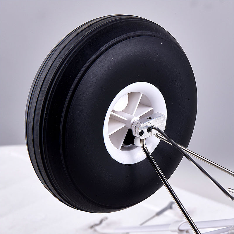 FMS 1300mm PA-18 Super Cub oversized pneumatic rubber tire with metal axle mount.