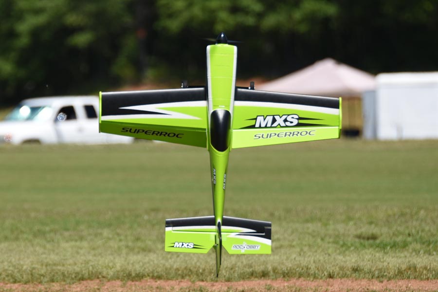 FMS 1100mm MXS V2 PNP green aerobatic RC airplane with black accents and 'MXS SUPERROC' branding.
