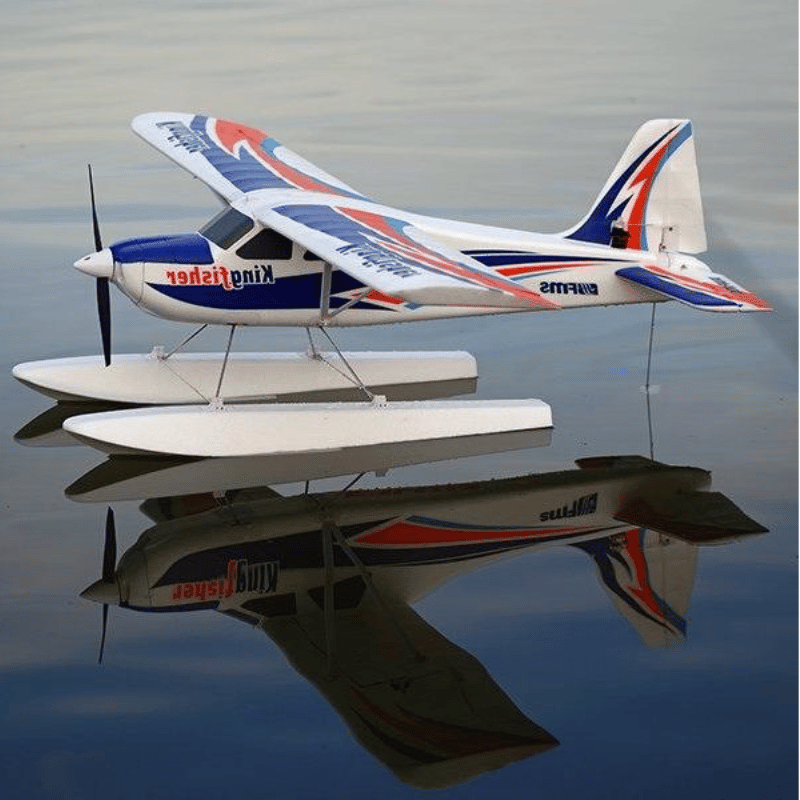 FMS 1400mm Kingfisher PNP seaplane with floats on water, showcasing its blue, red, and white livery and propeller.