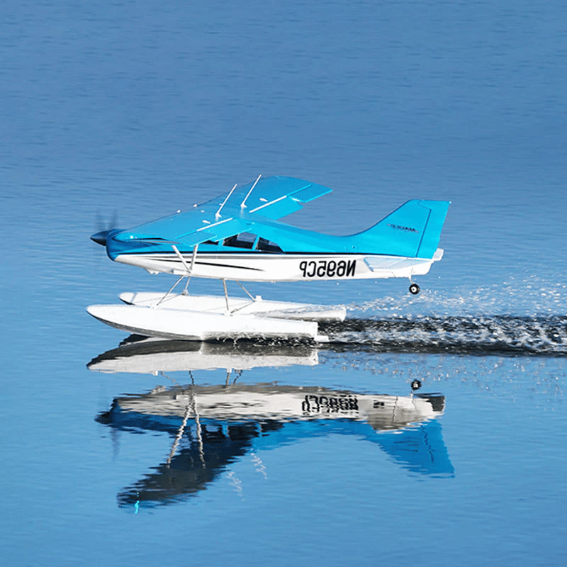 FMS Maule PNP flying over water with floats and clear reflections