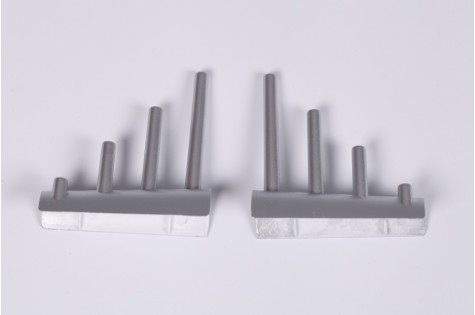 Gray plastic gun set RC model parts with rods for assembly.