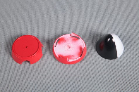 P-51D spinner components in red and black colors with detailed finishes.