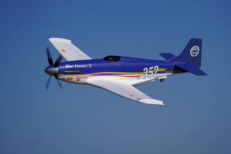 FMS 1100mm P-51 Mustang V2 PNP "Blue Thunder II" RC plane, #352, in flight. Blue/white livery, clear blue sky.