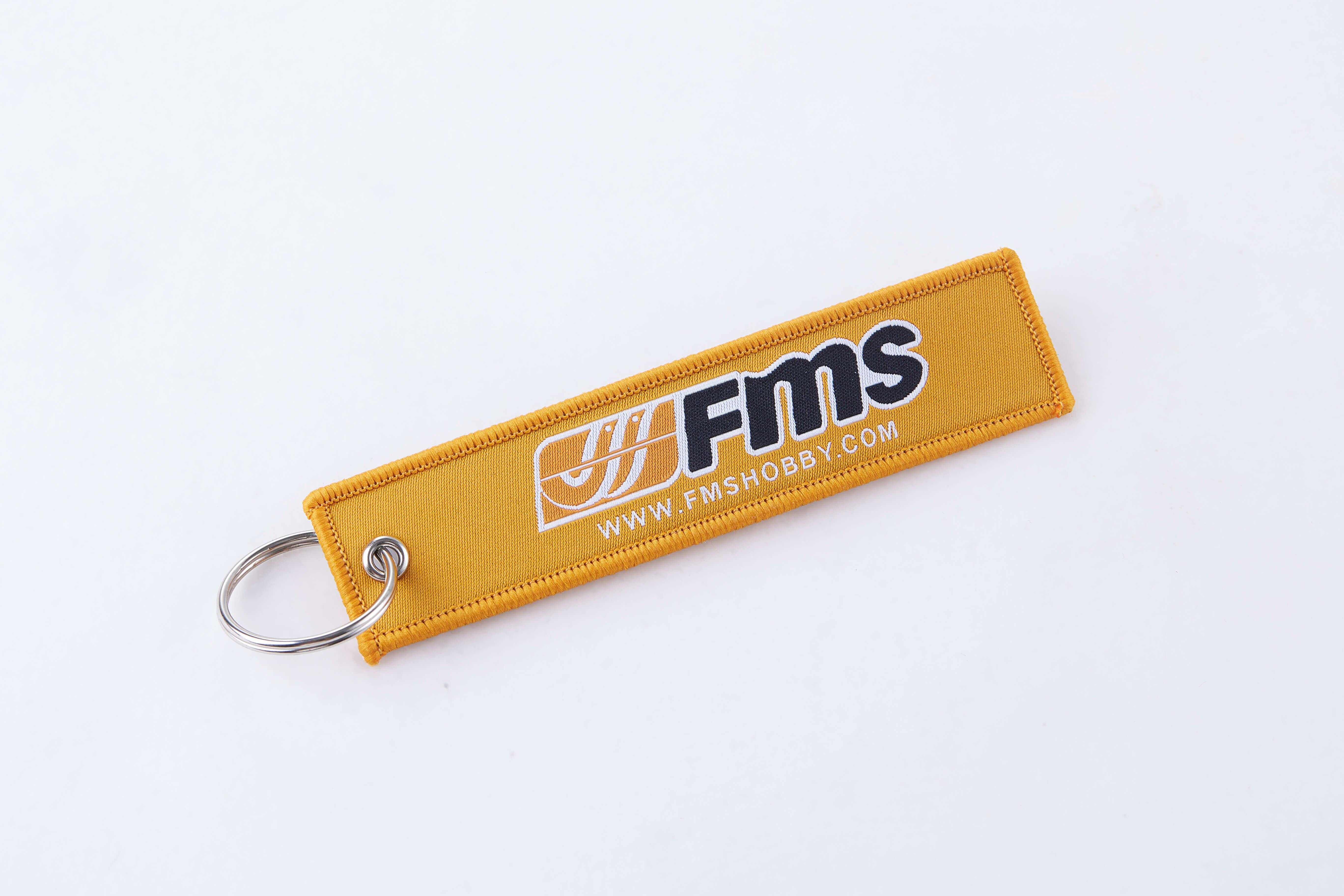 Yellow FMS keychain with logo for RC model enthusiasts