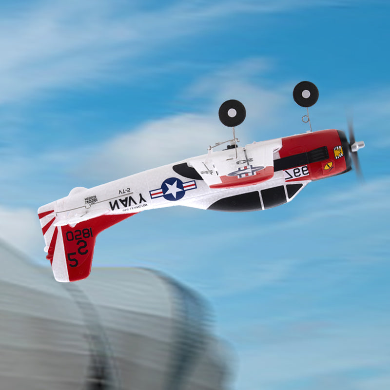 FMS 410mm T-28 Trojan RTF RC plane flying, red/white livery, US Navy star, extended landing gear.
