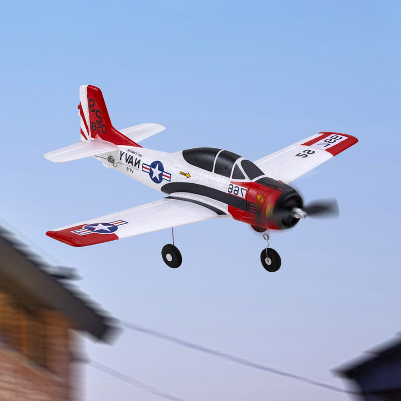 FMS 410mm T-28 Trojan RTF RC airplane in flight, white with red and black accents.