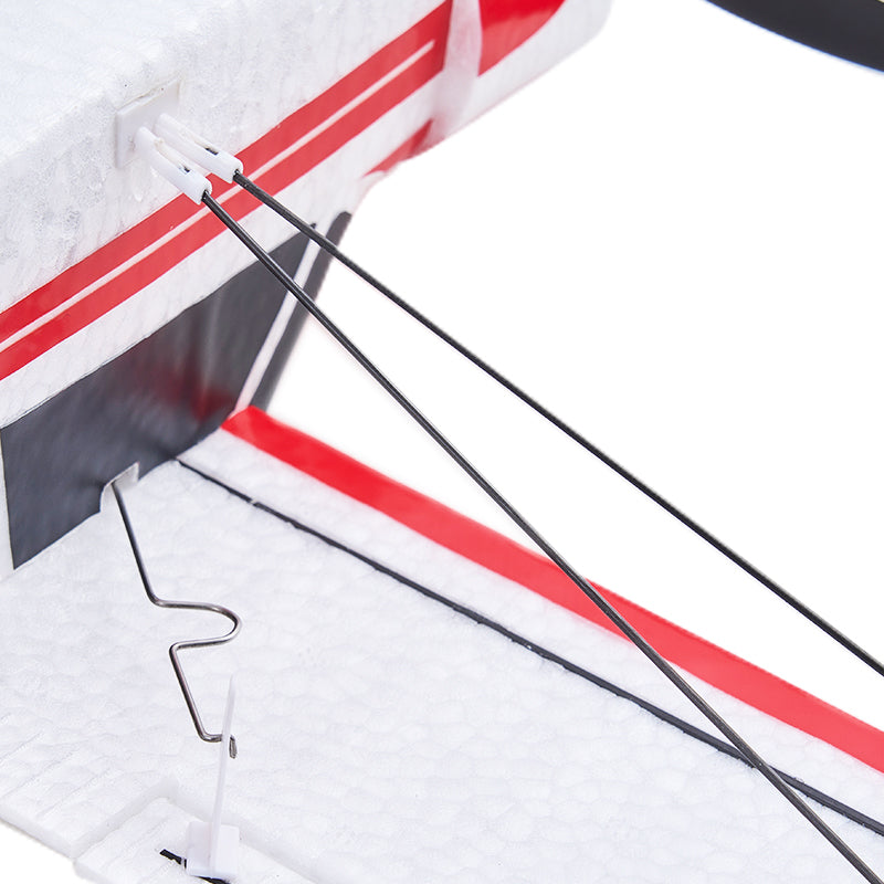FMS 500mm PA-18 Super Cub RTF: Close-up of control linkage and wing detail.