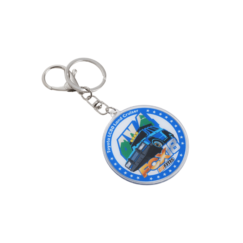 Toyota LC80 Land Cruiser keychain with blue background and checkered design.