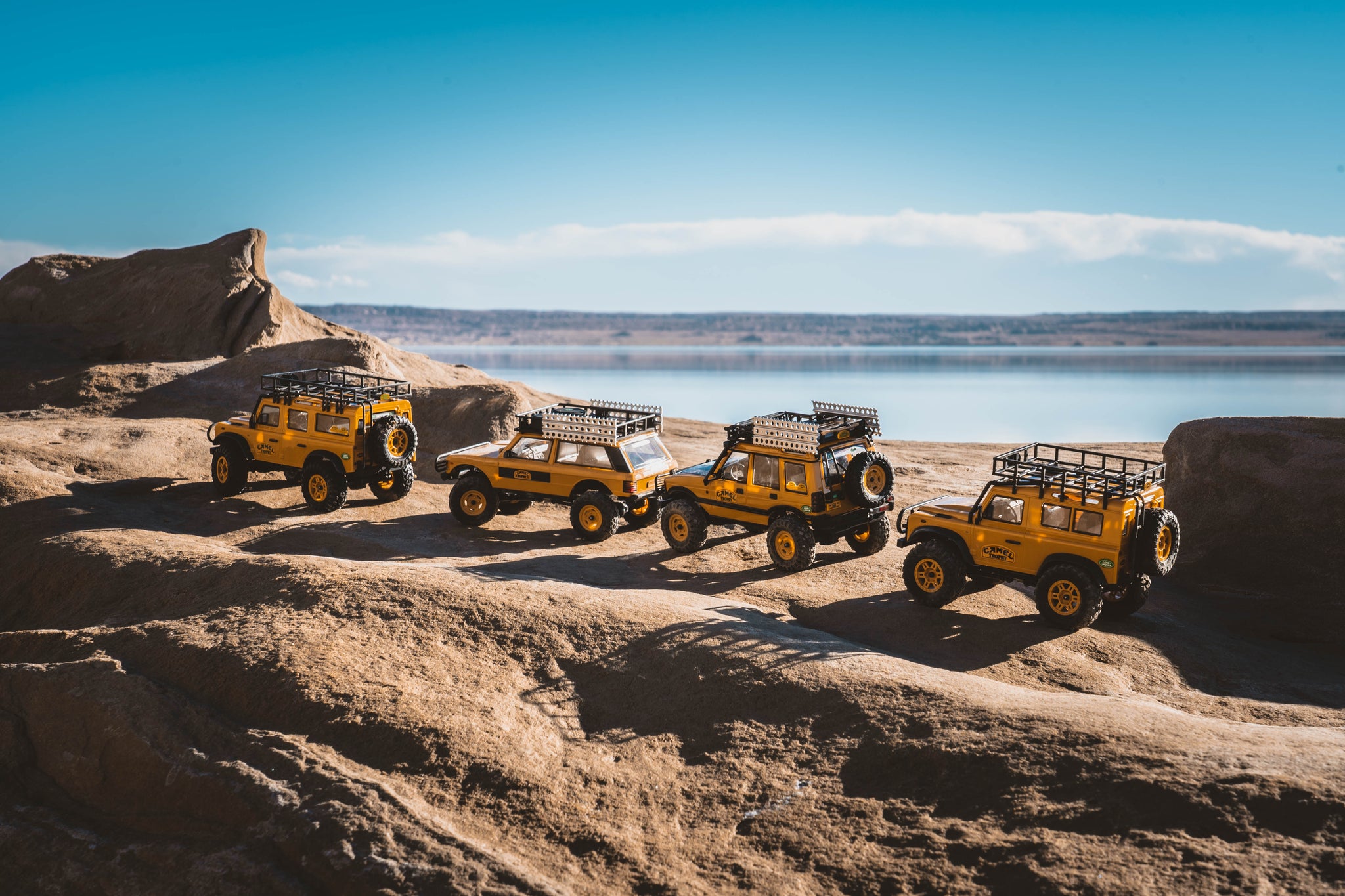 Fmshobby Land Rover remote control rock crawler navigating challenging outdoor obstacles