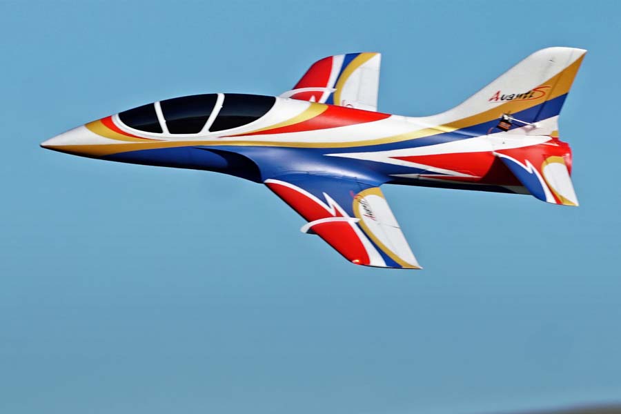 FMS EDF Jet 70mm Avanti V3 PNP in flight with red, white, blue, and gold livery