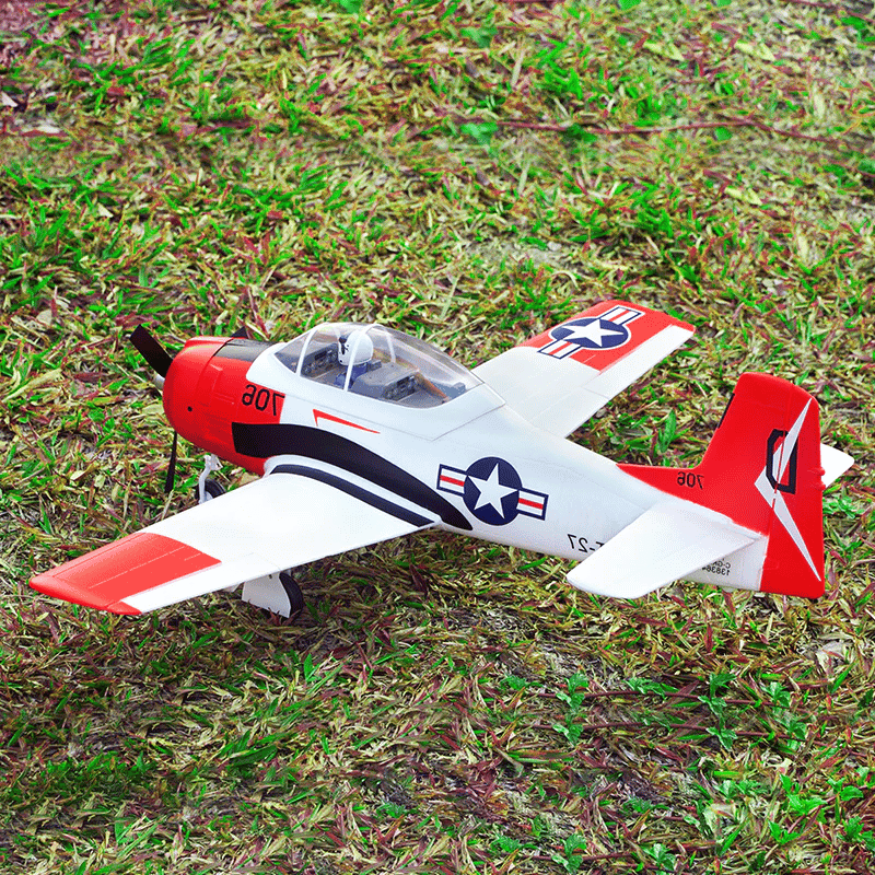 FMS 800mm T-28 Trojan V2 PNP Red model aircraft with US Navy markings on grass
