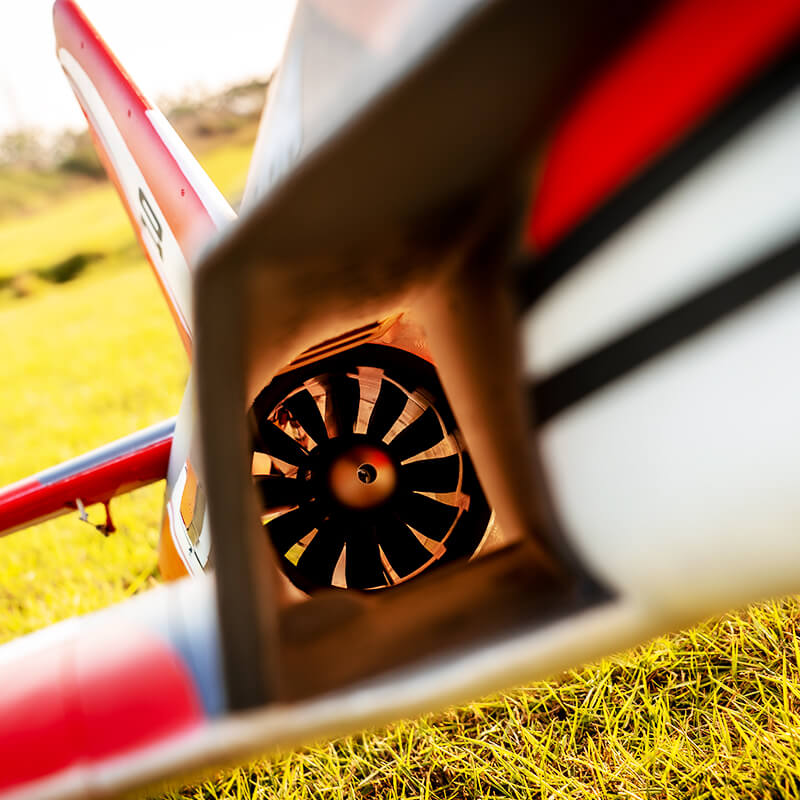 FMS 80mm Futura V3 PNP RC jet ducted fan with red and white fuselage on grass