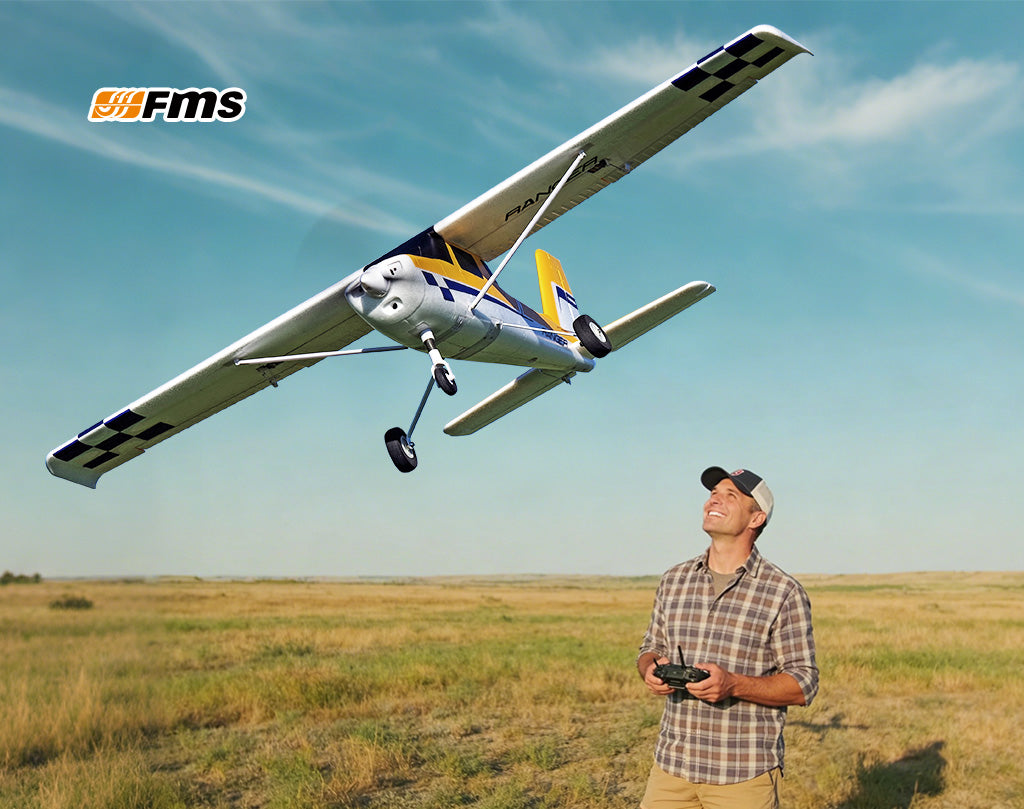 Man flying FMS high-wing RC airplane