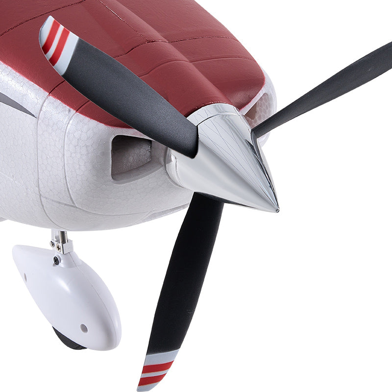 FMS 1500mm Cessna 182 RC airplane front view with red and white details on propeller blades.