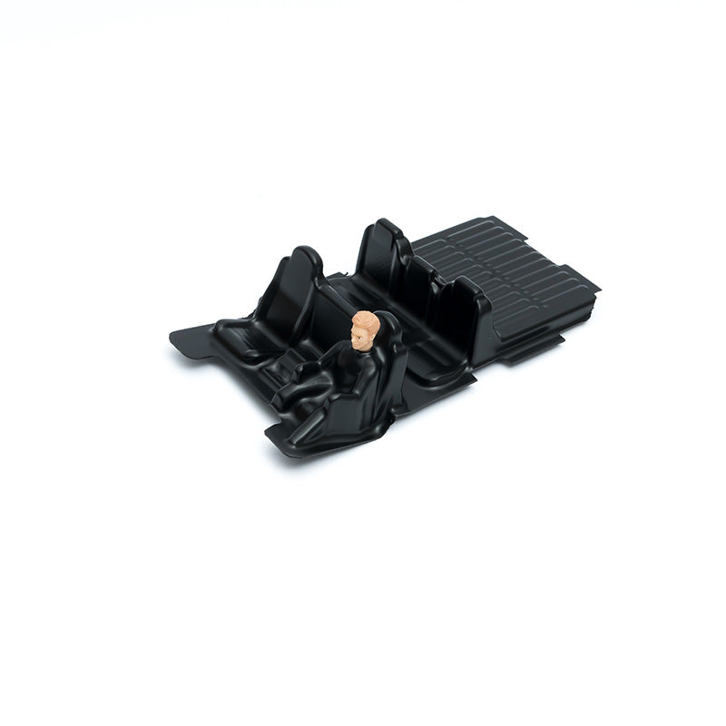 FCX24M black seat compartment upgrade with figure for RC model vehicles.