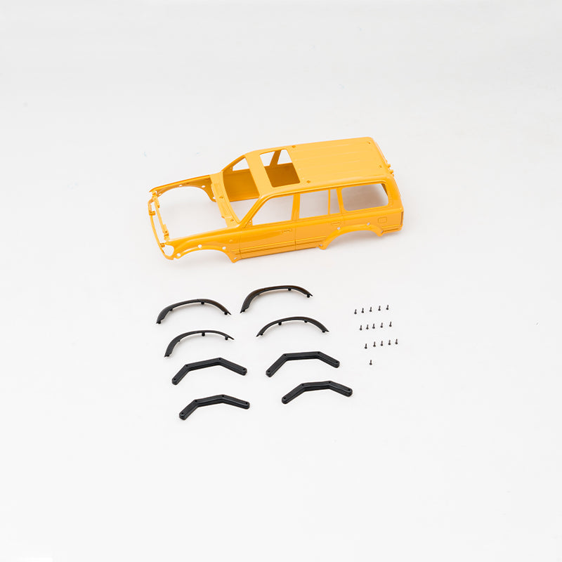 FCX18 LC80 Land Cruiser V2 orange-yellow body shell, fender flares, and screws.