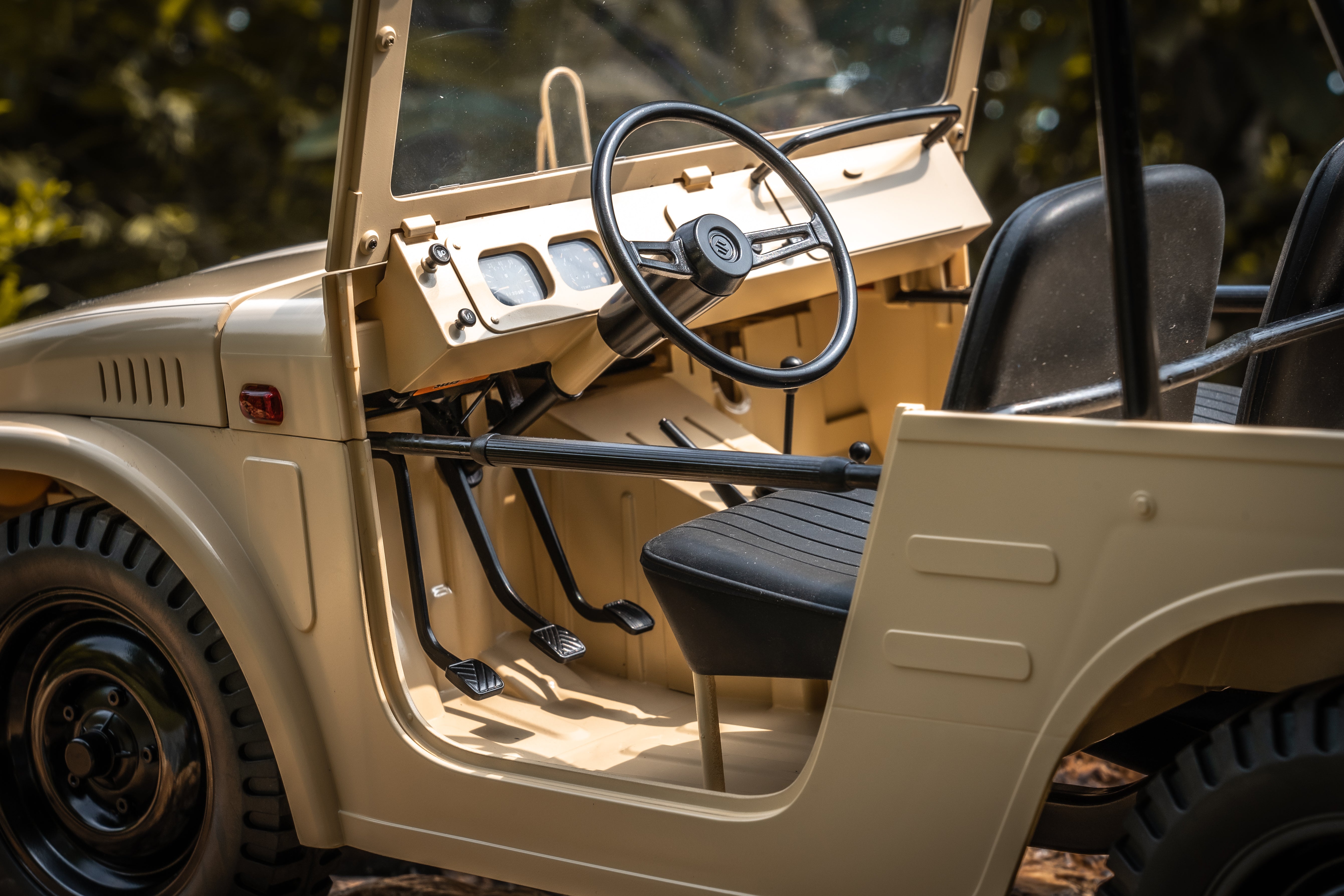 FMS 1:6 Jimny RS Brown RC car interior with beige dashboard, black steering wheel and seats.