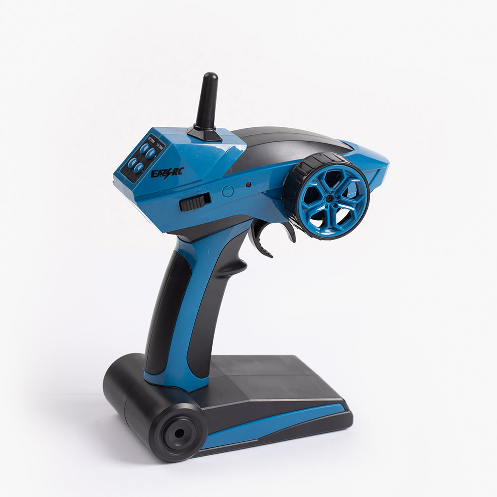 Blue and black TRITON 1:18 scale RC transmitter with steering wheel and trigger.
