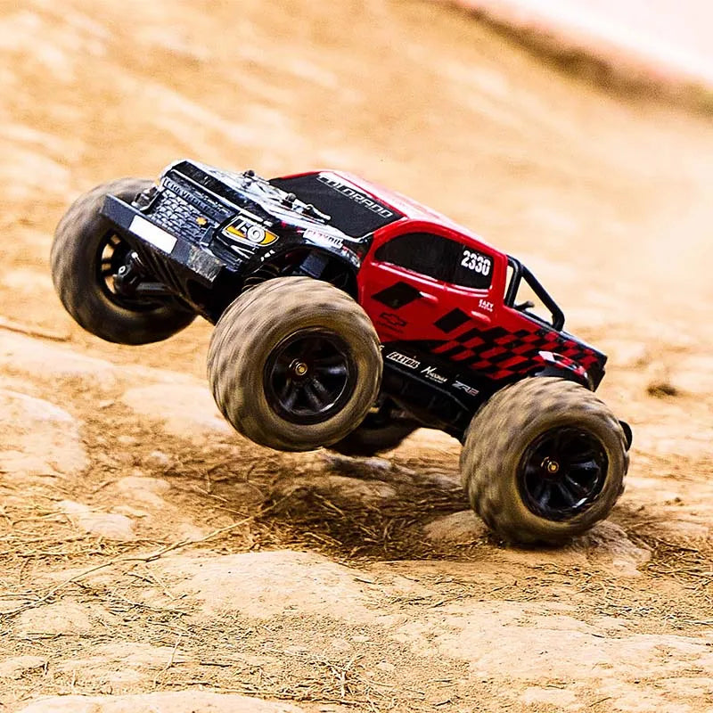 EAZYRC 1:18 Chevrolet Colorado off-road truck mid-air jump, red and black with checkered decals and large tires.