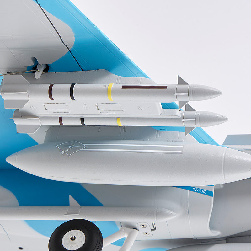 FMS 64mm F/A-18 Hornet jet model with missiles, showing intake detail and blue camouflage pattern.