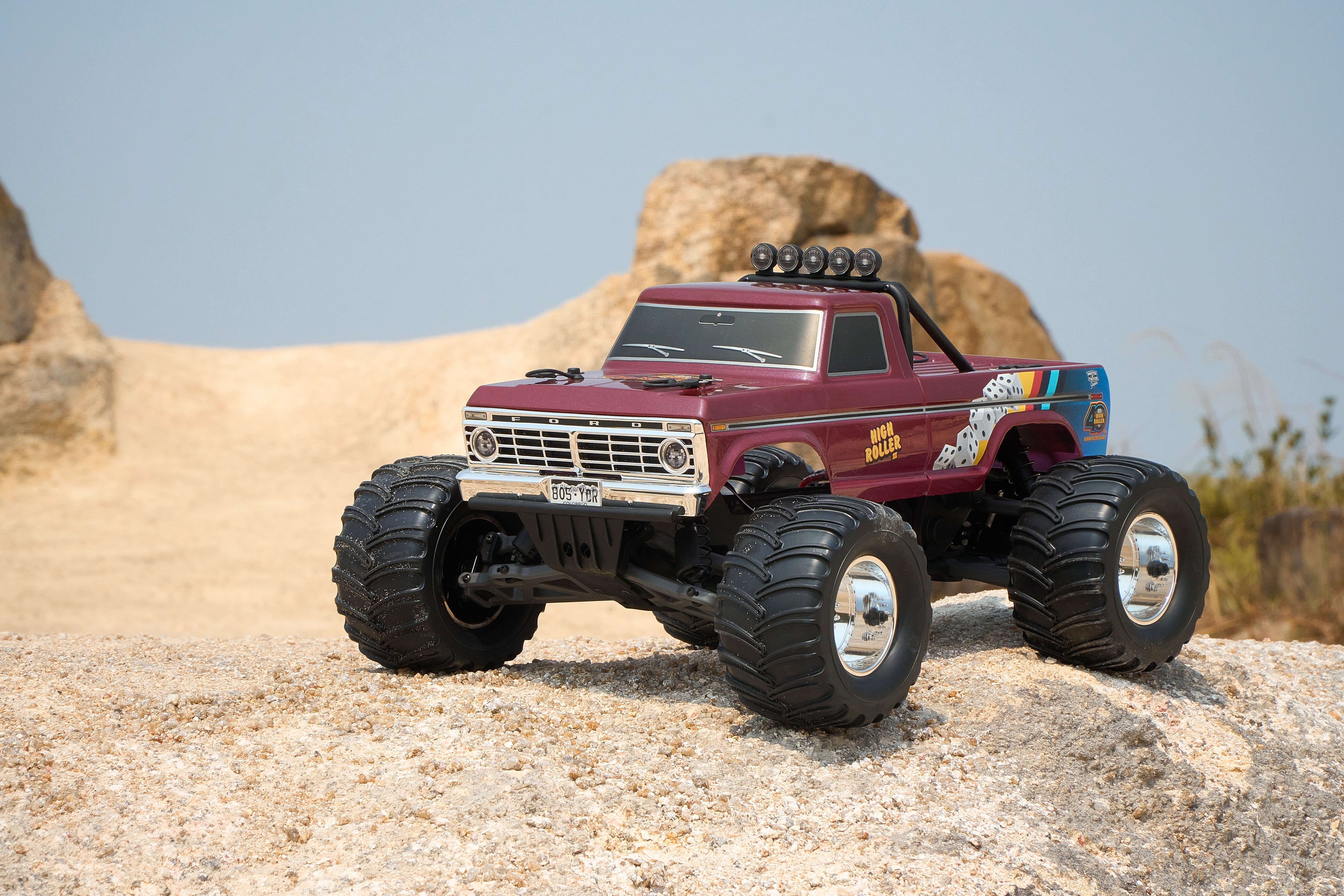 Purple RC truck on rocky terrain
