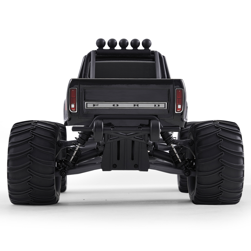 FMS 1:10 Ford F100 Monster Truck rear view, black, large tires, silver 'FORD' lettering