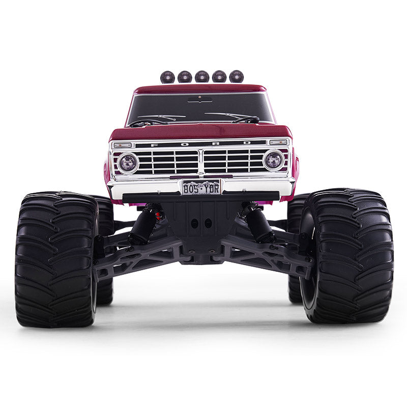 FMS 1:10 Ford F100 Monster Truck, red, with large black tires, visible grille and headlights, on a white background.