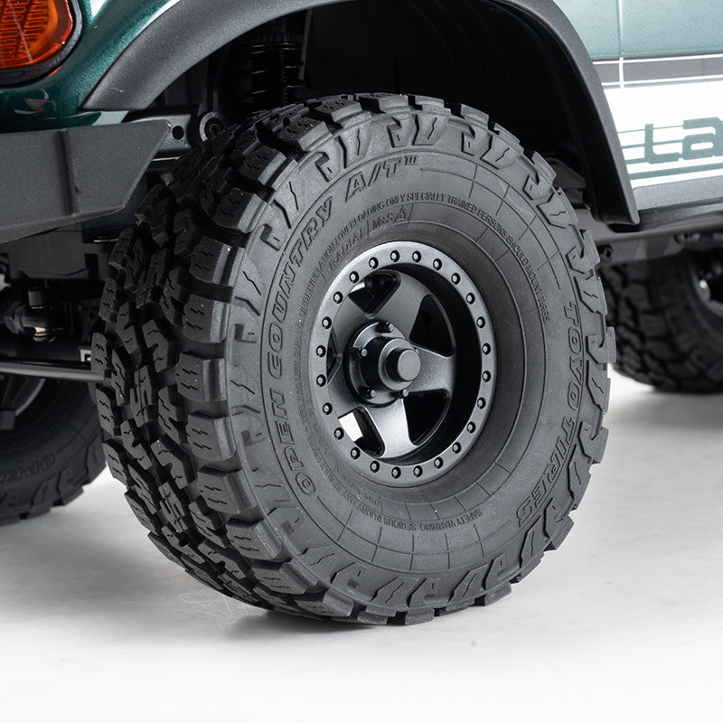 FMS 1:10 LC80 RS crawler with Toyo Open Country A/T III tires and black beadlock wheels
