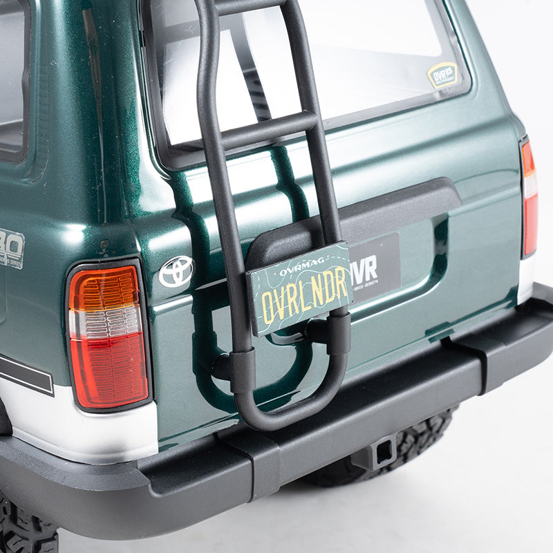 FMS 1:10 FCX10 LC80 RS rear with black ladder and OVRLNDR license plate.